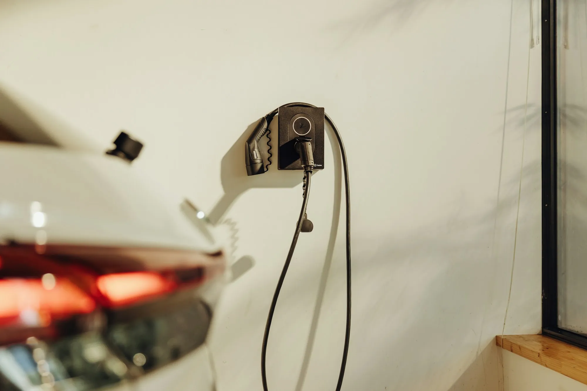 Electric car charger mounted on a wall
